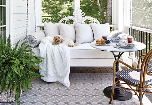 Porch white furniture, small dog